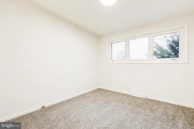 a bathroom with a tub a sink and a mirror