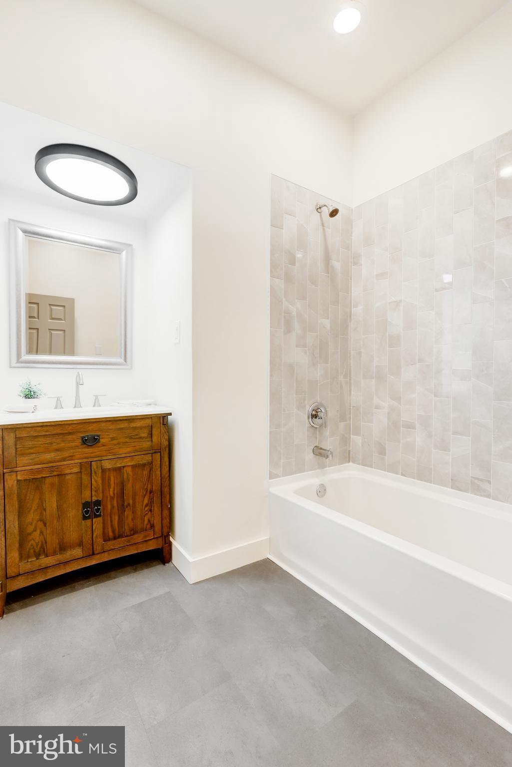 904 South Chester Road West Chester, PA 19382 - Photo 47 of 47 a bathroom with a tub a sink and a mirror