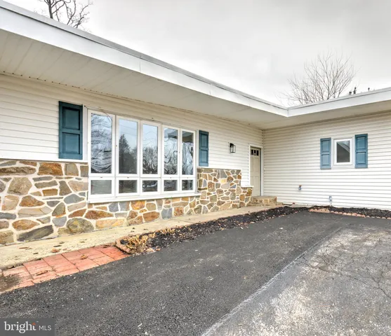 a view of a house with a backyard and a window