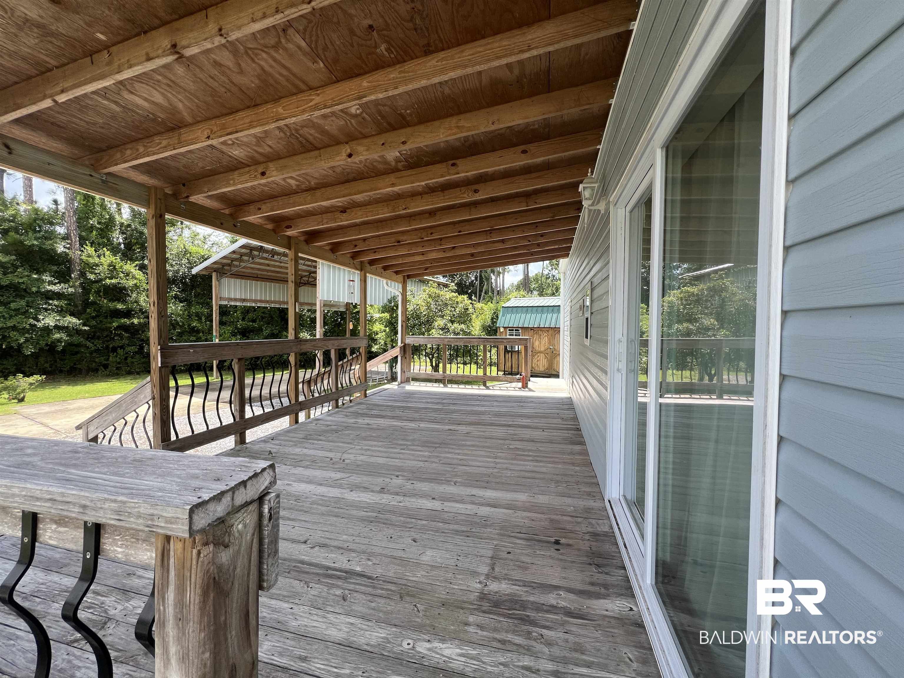 662 Escambia Loop Lillian, AL 36549 - Photo 3 of 26 View of wooden deck