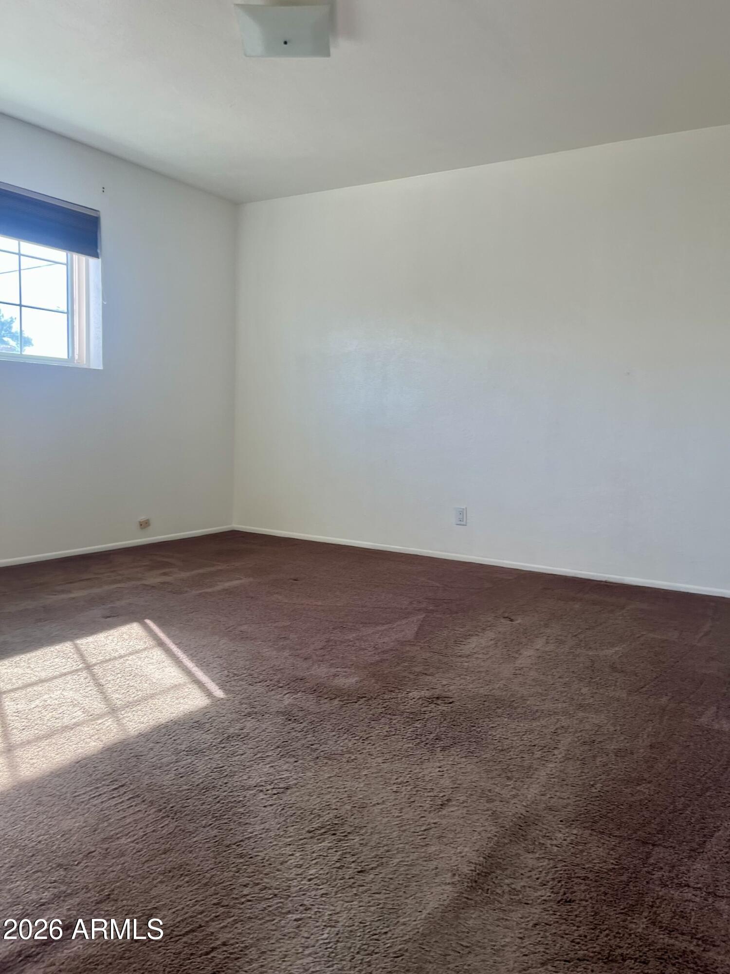 2315 West Butler Drive Phoenix, AZ 85021 - Photo 9 of 13 an empty room with a workbench