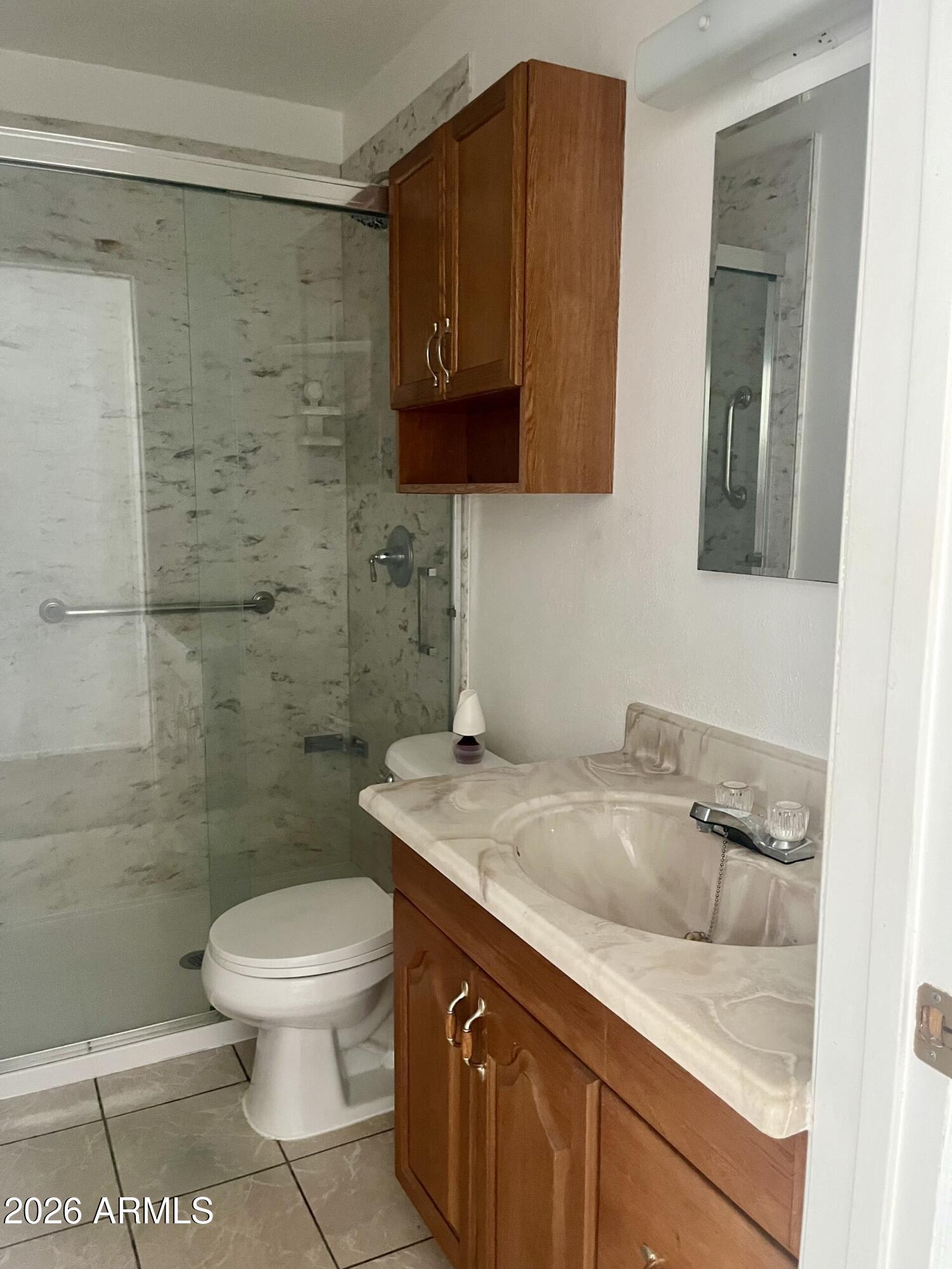 2315 West Butler Drive Phoenix, AZ 85021 - Photo 10 of 13 a bathroom with a sink a toilet and shower