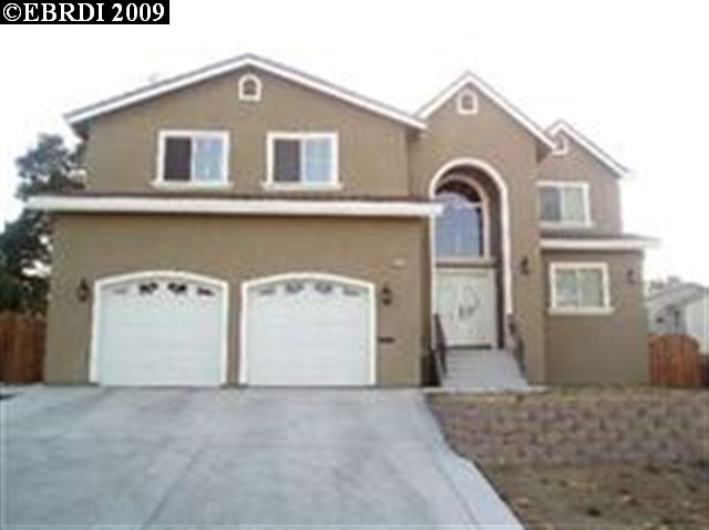 556 Lake Avenue Rodeo, CA 94572 - Photo 1 of 1 a front view of a house with a yard