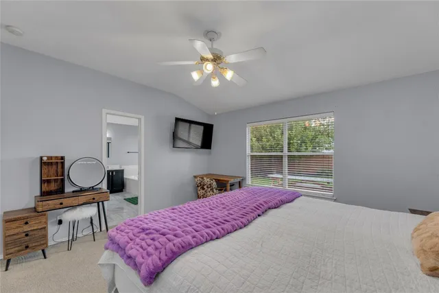 a bedroom with a bed and window