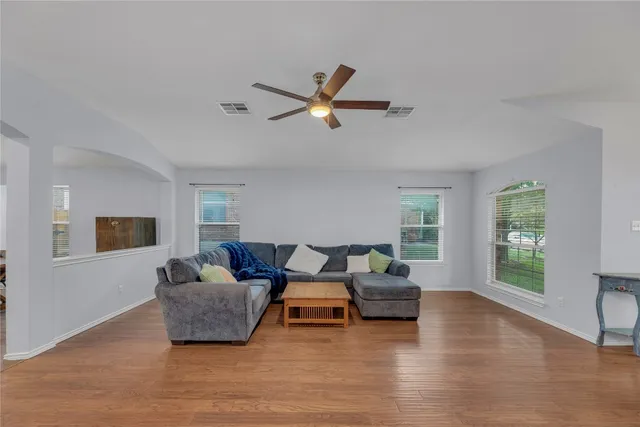 a living room with furniture and a window