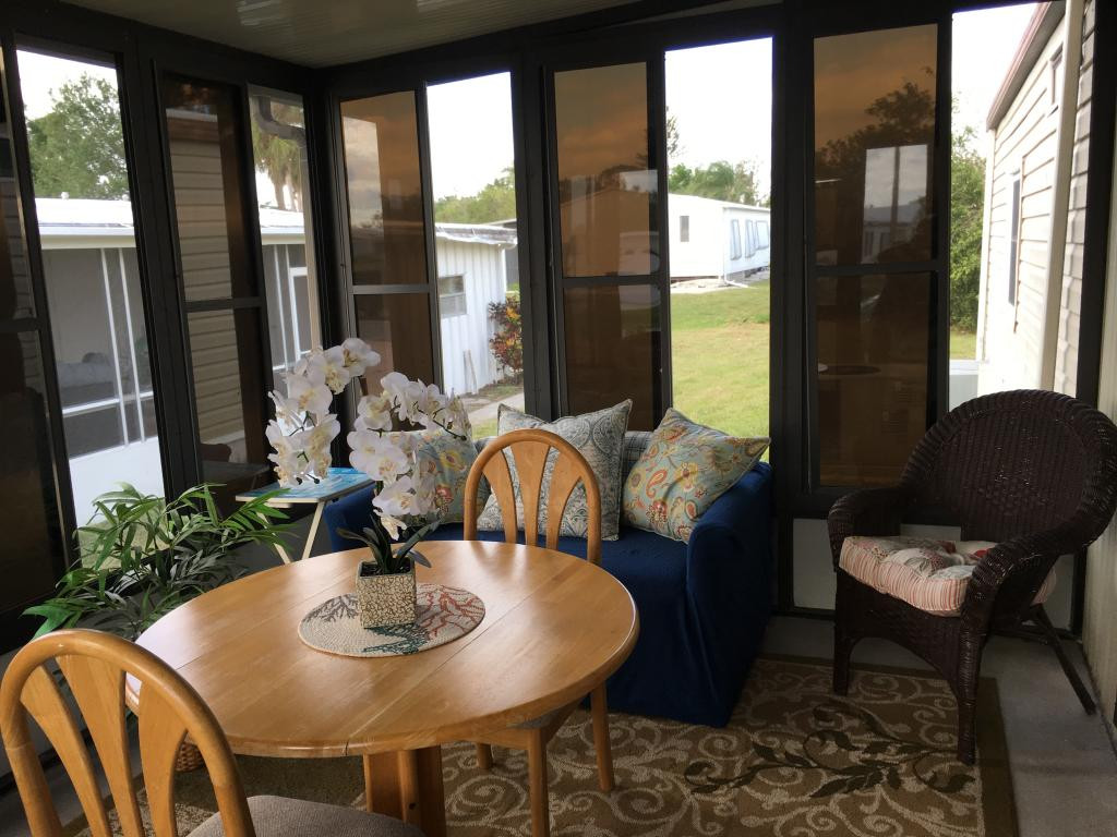 108 Audubon Road Naples, FL 34114 - Photo 3 of 11 a view of a dining room with furniture window and outside view