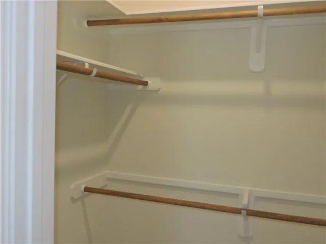 a view of a patio with dining table and chairs