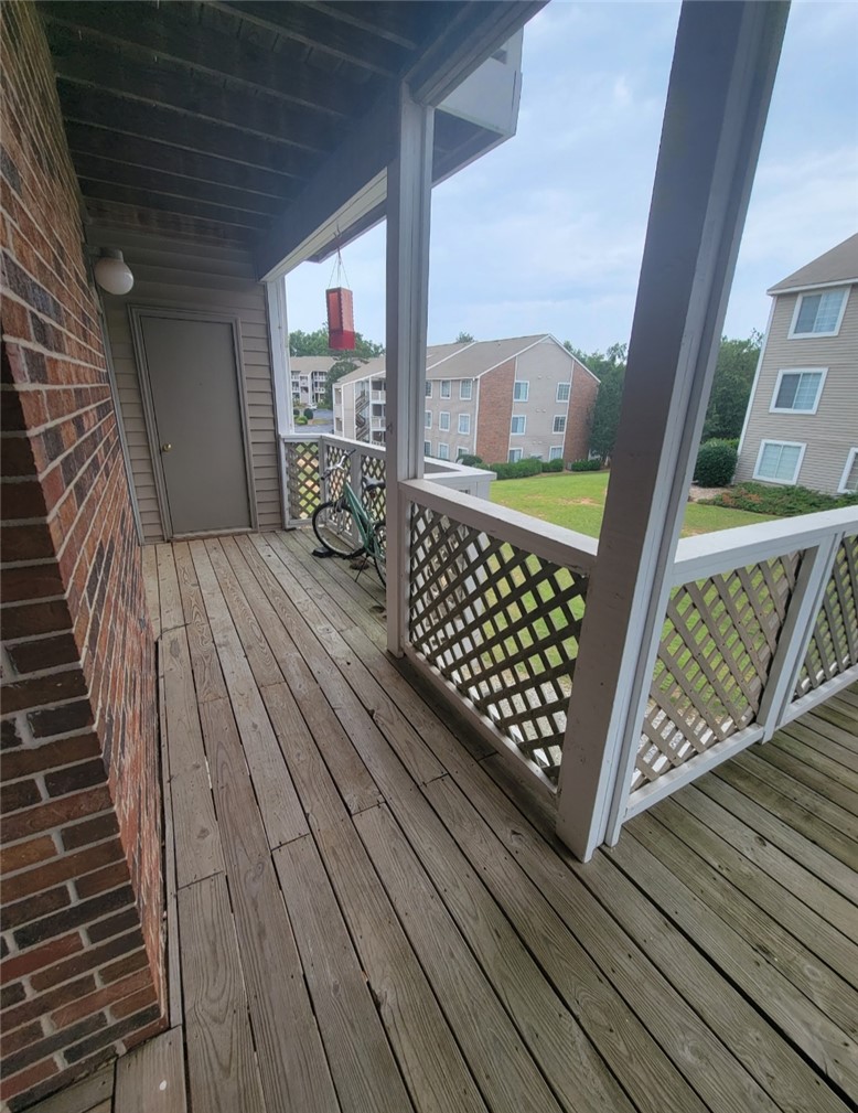 220 Elm Street, Unit 423 Clemson, SC 29631 - Photo 14 of 14 This spacious wooden deck offers serene views, perfect for unwinding outdoors.