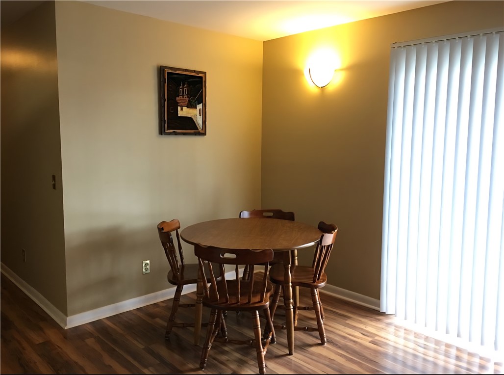 220 Elm Street, Unit 423 Clemson, SC 29631 - Photo 5 of 14 This cozy dining area features rich wood flooring and abundant natural light.