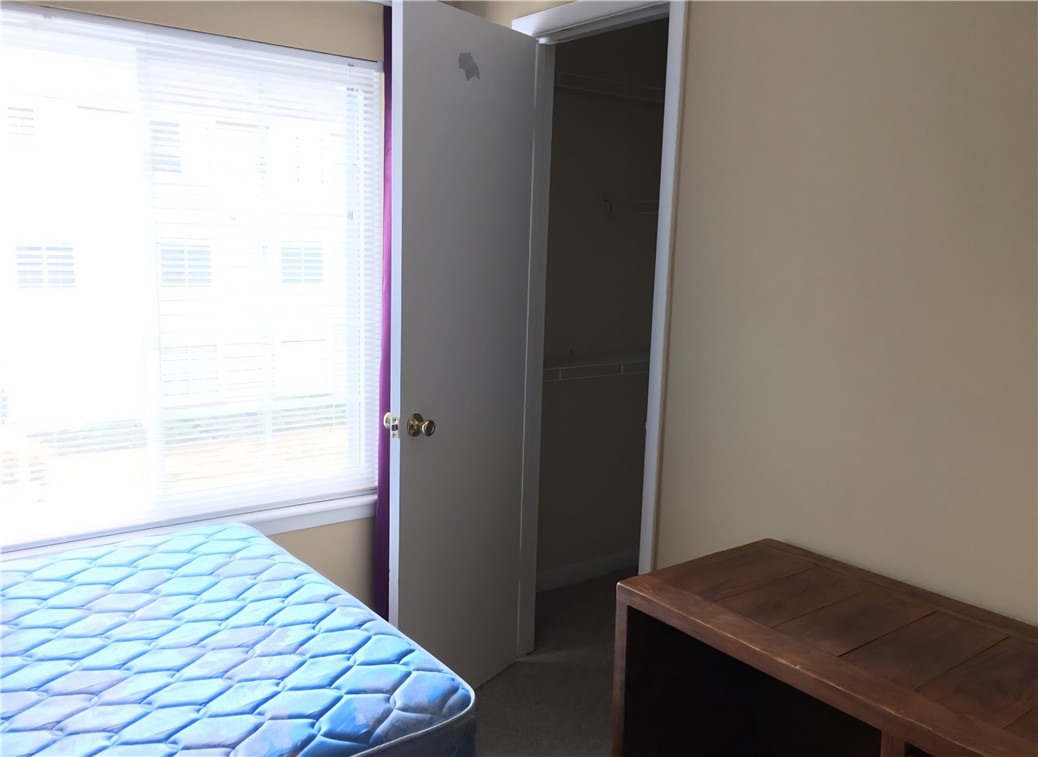 220 Elm Street, Unit 423 Clemson, SC 29631 - Photo 10 of 14 This cozy bedroom provides a comfortable retreat with a spacious walk-in closet and ample natural light.
