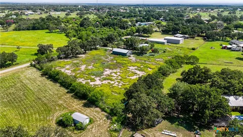 a view of a garden with lawn chairs