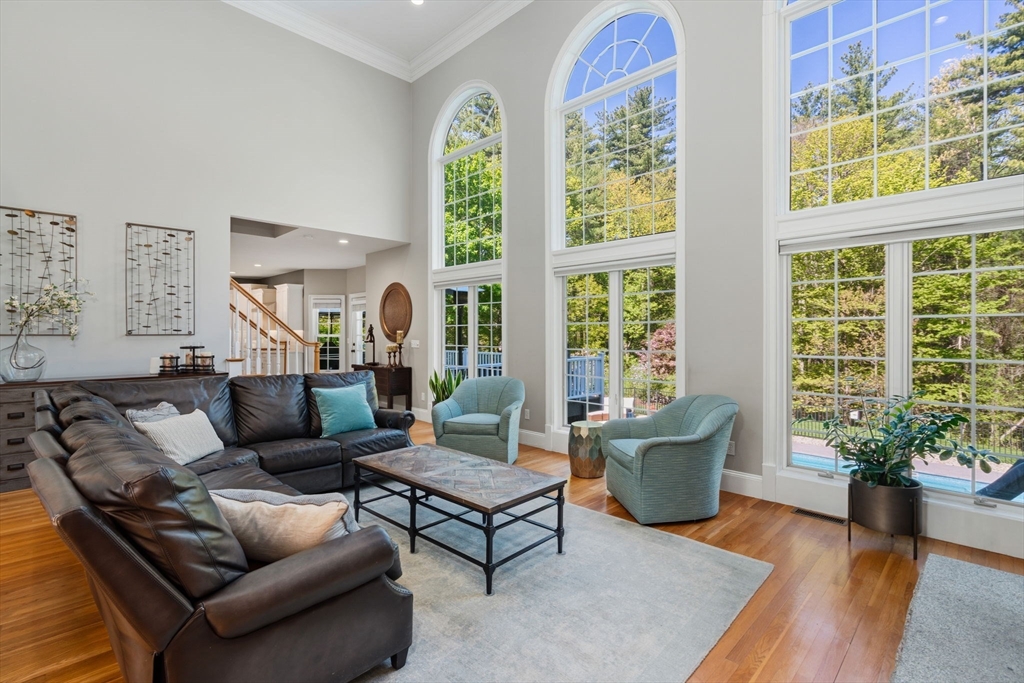 220 Newtown Road Acton, MA 01720 - Photo 8 of 39 a living room with furniture and a potted plant