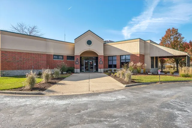 a view of swimming pool is middle in the garden