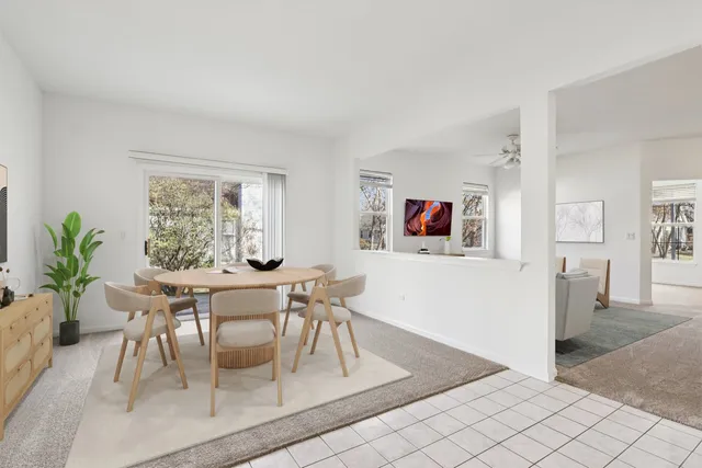 a open kitchen with white cabinets and stainless steel appliances