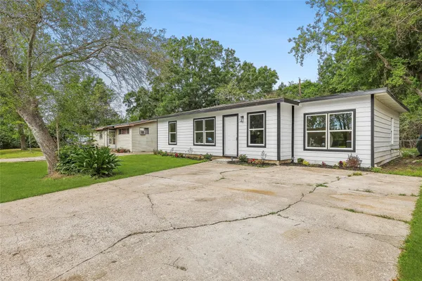 a house with trees in the background