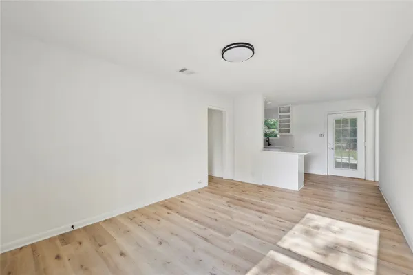 a view of a livingroom with wooden floor