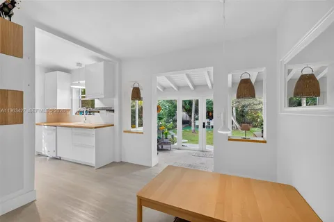 a view of a kitchen with furniture and window