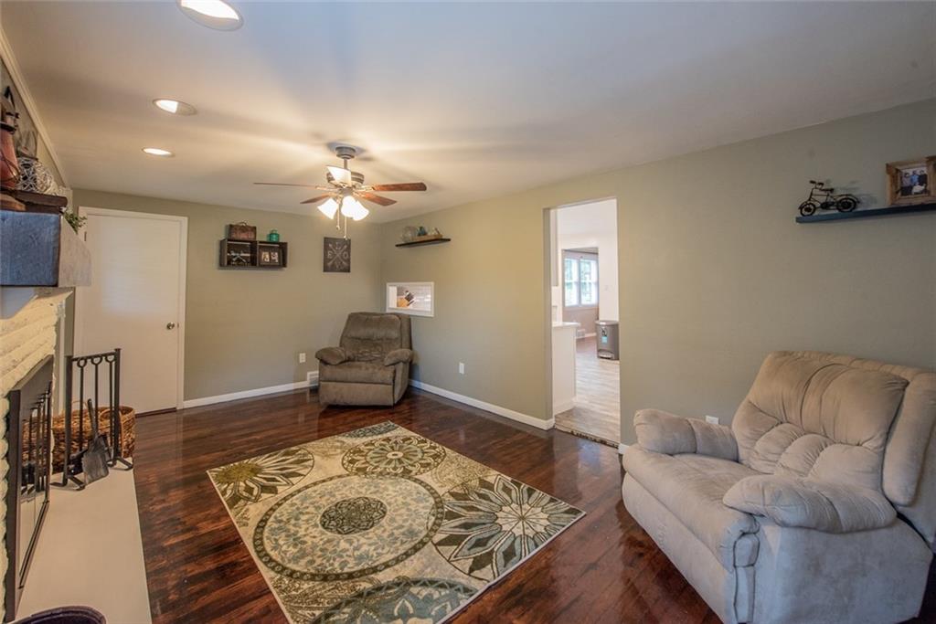 211 Rush Valley Road Monroeville, PA 15146 - Photo 13 of 25 Family Room with wood burning fireplace/gas starter. Custom Mantle stone fireplace. Wood floors and ceiling fan!
