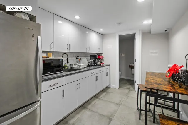 a bathroom with a sink a mirror and a toilet