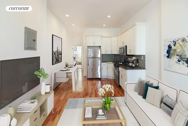 a living room with furniture a flat screen tv and a table