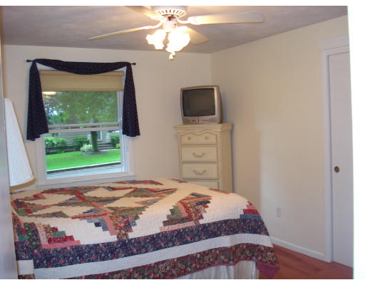 72 Corey Road Springfield, MA 01128 - Photo 16 of 26 a bedroom with a bed window and a flat screen tv
