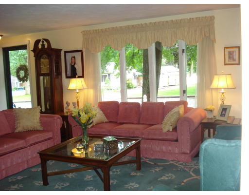 72 Corey Road Springfield, MA 01128 - Photo 2 of 26 a living room with furniture and a large window