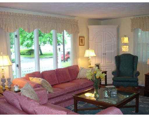 72 Corey Road Springfield, MA 01128 - Photo 3 of 26 a living room with furniture fireplace and a large window