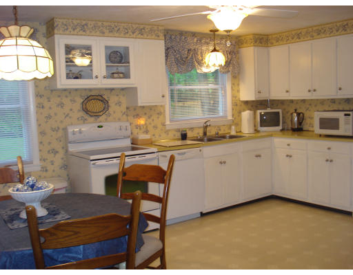72 Corey Road Springfield, MA 01128 - Photo 10 of 26 a kitchen with a sink cabinets and window