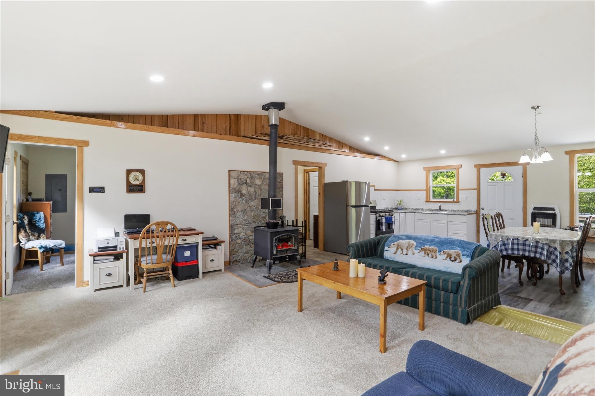 936 Johnny Cake Road Great Cacapon, WV 25422 - Photo 3 of 33 a living room with furniture and a table