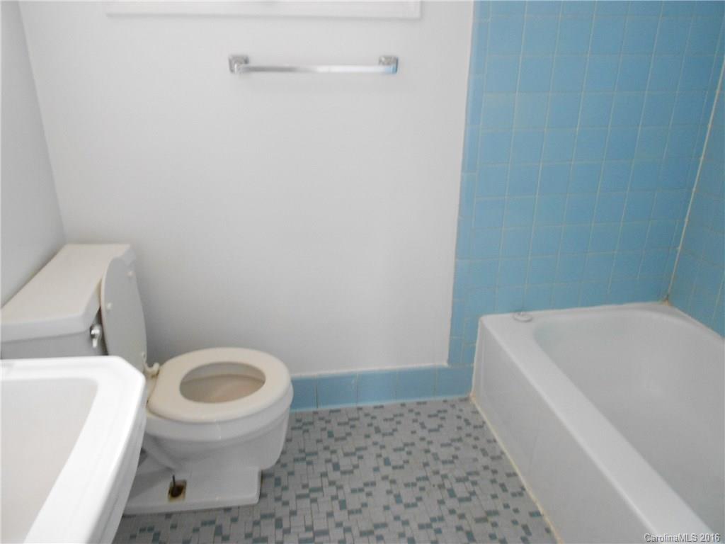 3830 Tuckaseegee Road, Unit 1 Charlotte, NC 28208 - Photo 5 of 6 a bathroom with a sink and toilet