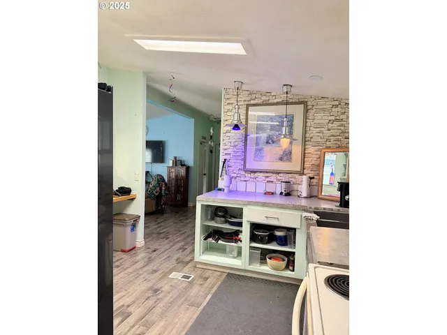 a view of a living room with furniture and a window