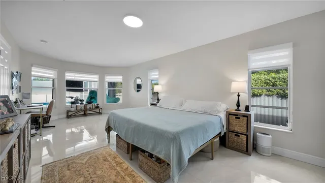 a bed room with a bed and window