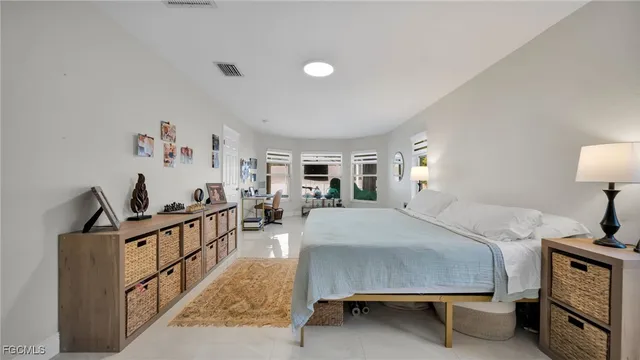 a bedroom with furniture and a window