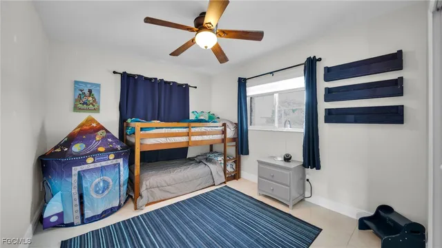 a bedroom with furniture and a window