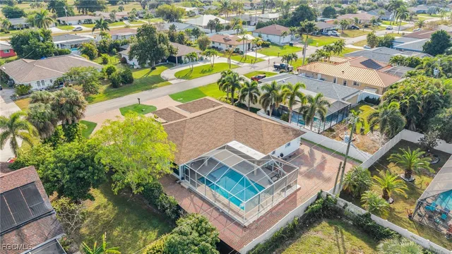 an aerial view of residential house with outdoor space and swimming pool