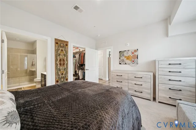 a bedroom with a bed and a couch