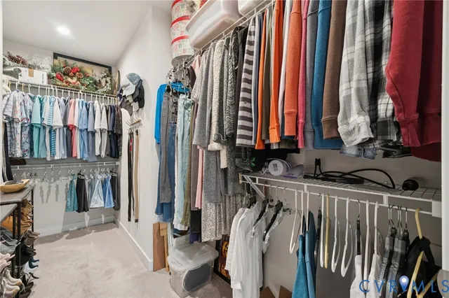 a bathroom with a double vanity sink a toilet and shower