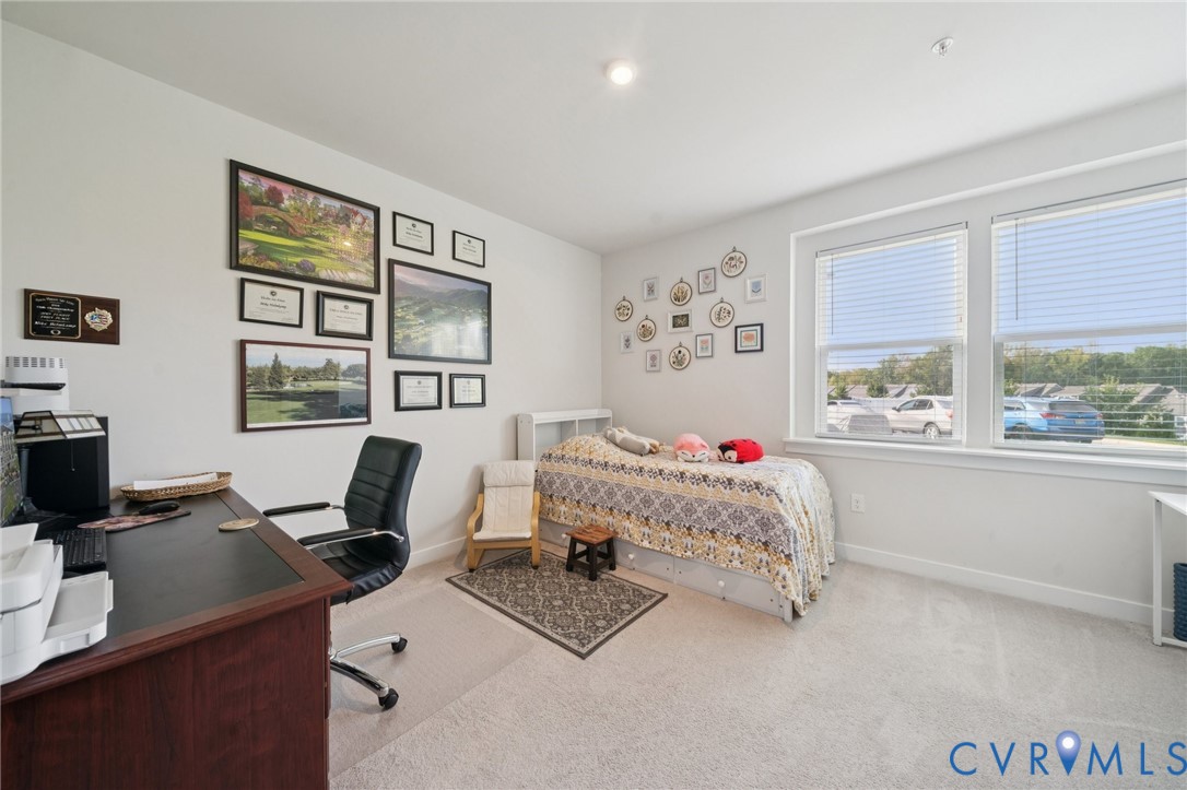 4000 Maze Runner Drive, Unit 103 Midlothian, VA 23112 - Photo 16 of 24 a bedroom with a bed and a desk
