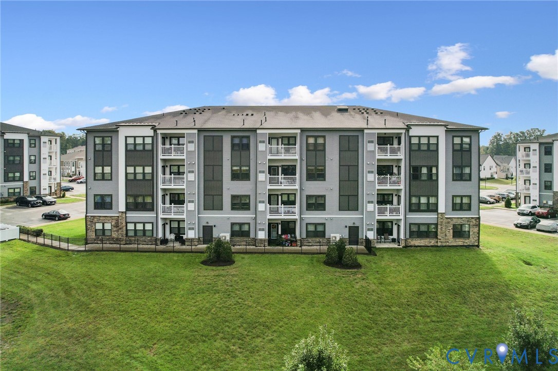 4000 Maze Runner Drive, Unit 103 Midlothian, VA 23112 - Photo 21 of 24 a view of a house with a backyard