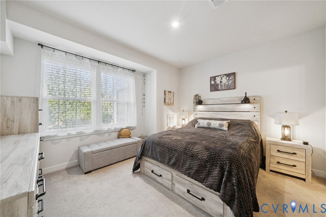 4000 Maze Runner Drive, Unit 103 Midlothian, VA 23112 - Photo 9 of 24 a bedroom with a bed and a couch