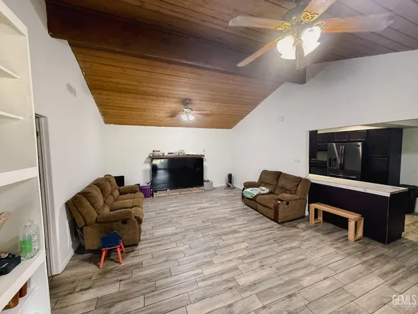 a bed room with a bed and a television