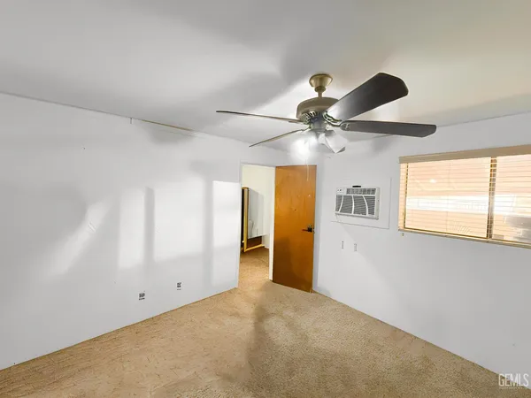 a living room with a flat screen tv and a window