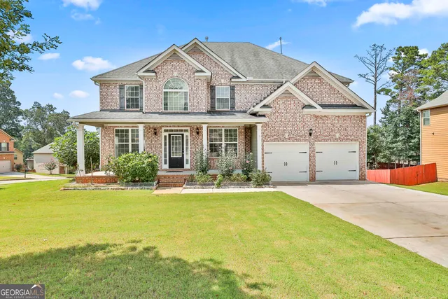 a front view of a house with swimming pool