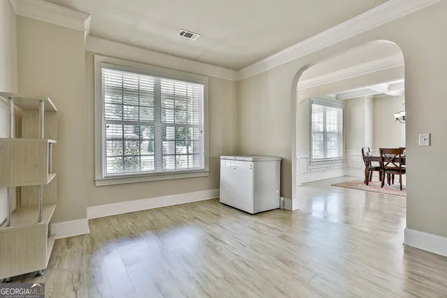 a view of a dining room with furniture window and wooden floor