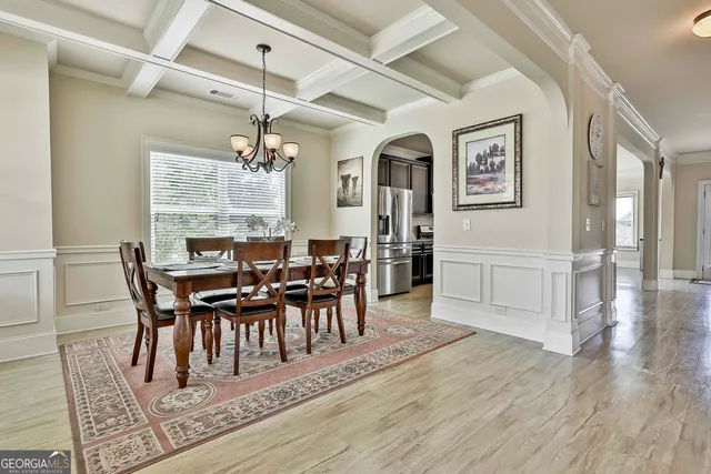 a view of a dining room with furniture window and wooden floor