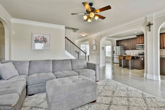 a living room with furniture fireplace and flat screen tv