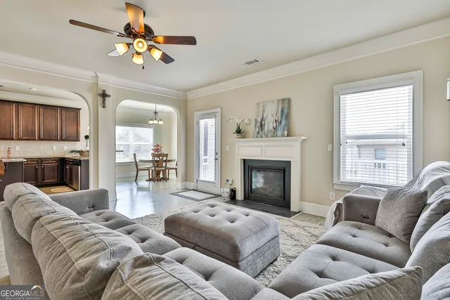 a kitchen with granite countertop wooden floors and stainless steel appliances