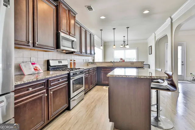 a dining room with furniture window wooden floor