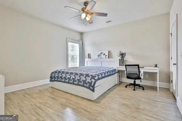 a view of a wooden deck with a yard