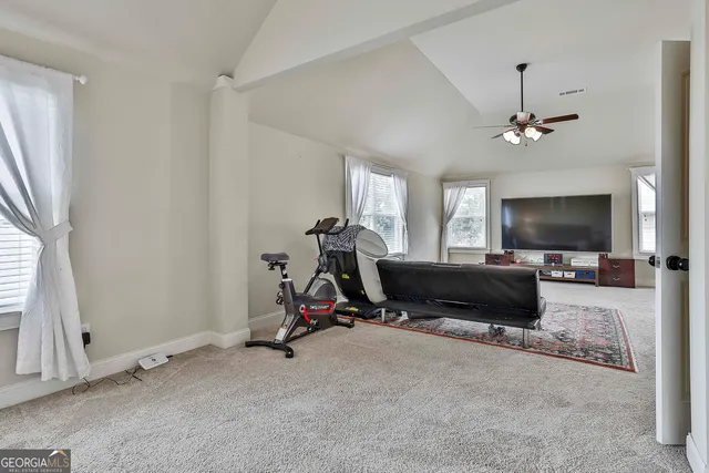 a bedroom with furniture and a chandelier
